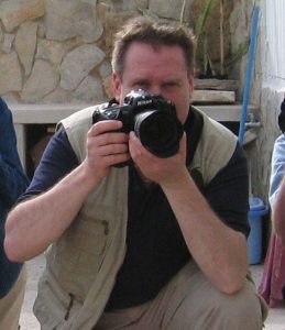 male photographer with Nikon camera