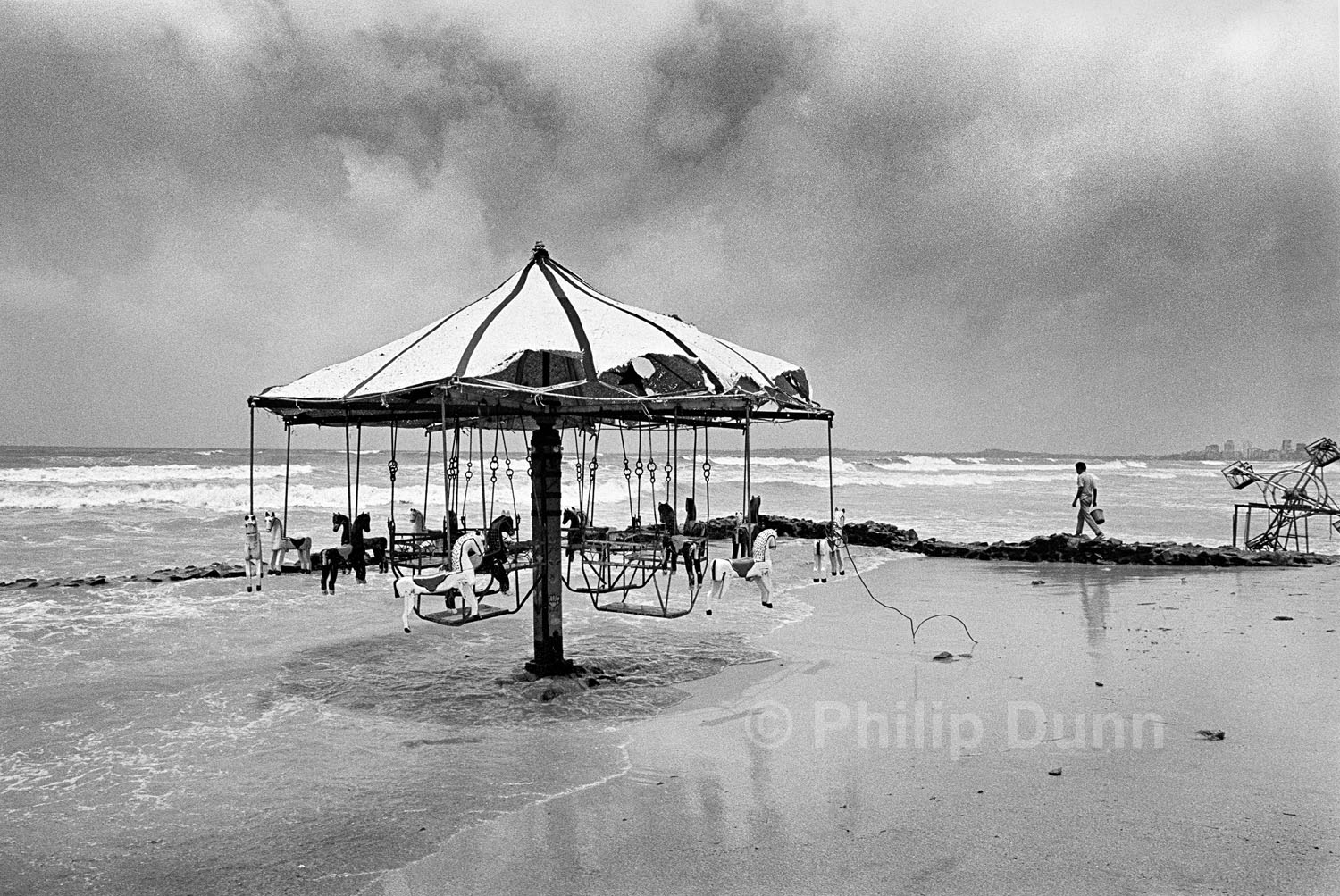 beach fairground washed by the tide at Juhu, Bombay, India