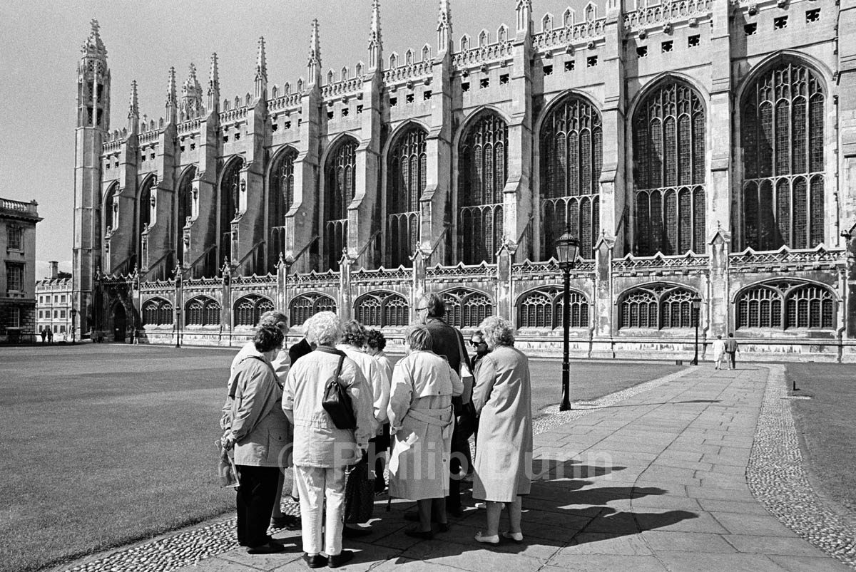 black and white photograph of tourist group outside Christ Church Cambridge