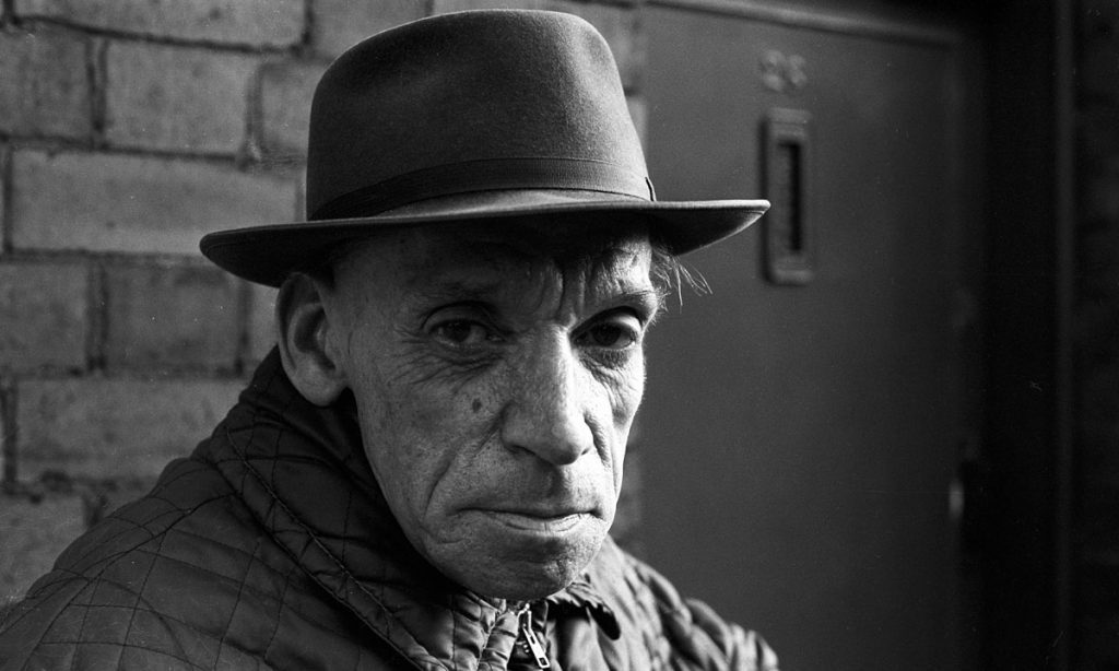street photography portrait of elderly man in trilby hat